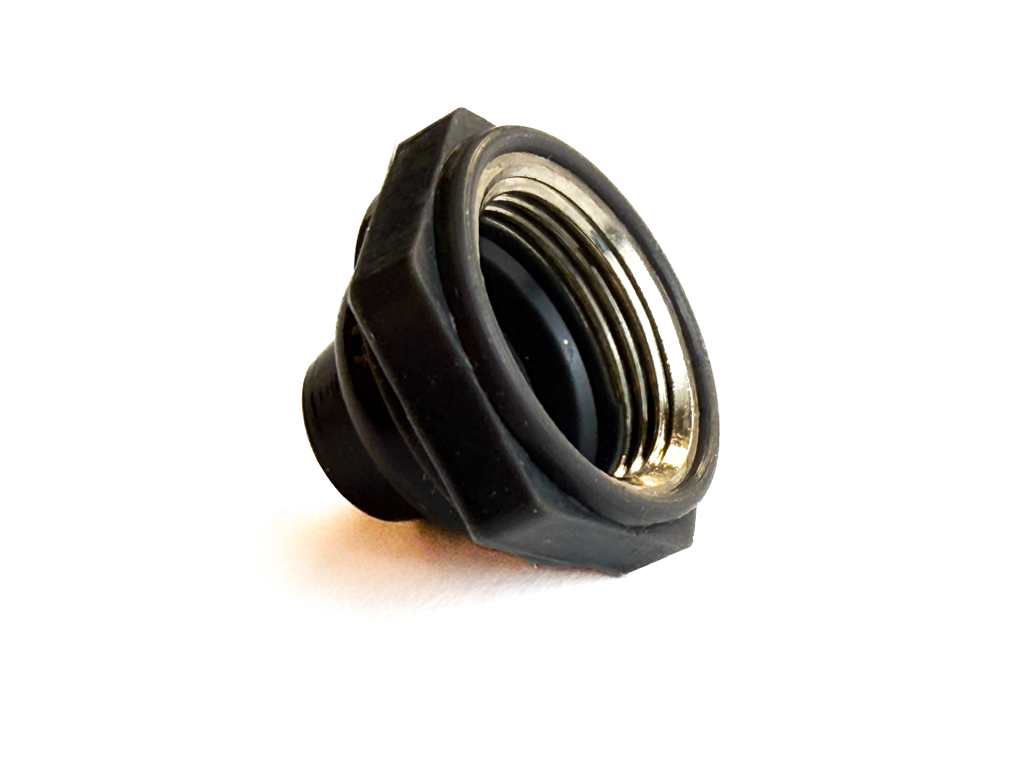 Overmolded silicone and stainless steel button