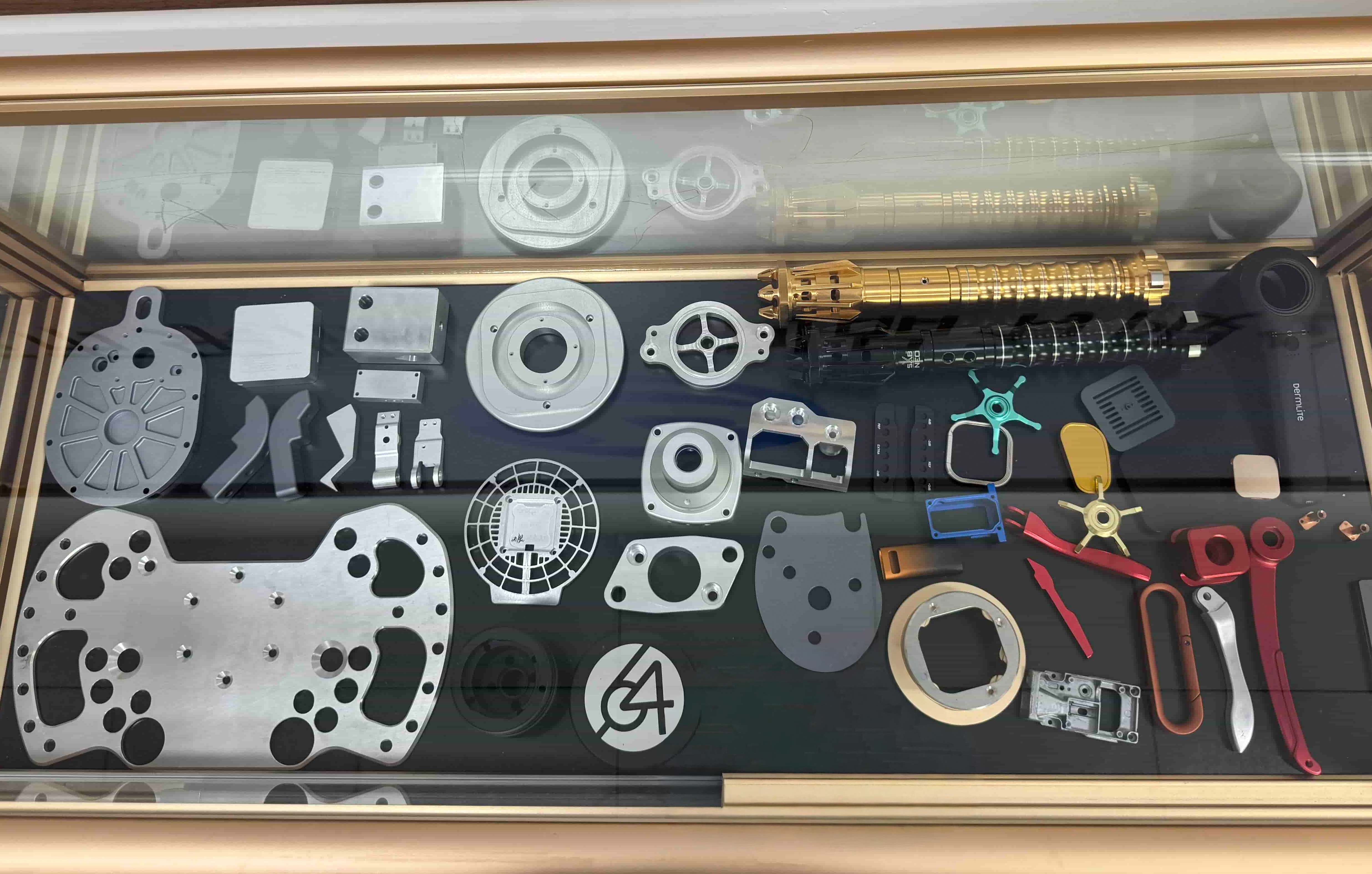 Display of machined rings, plates, fittings, and assorted custom components.