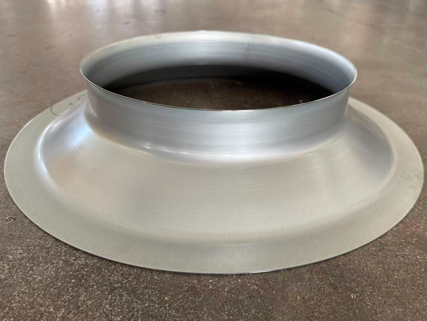 Silver metal collar with an open cylindrical neck and broad circular flange.